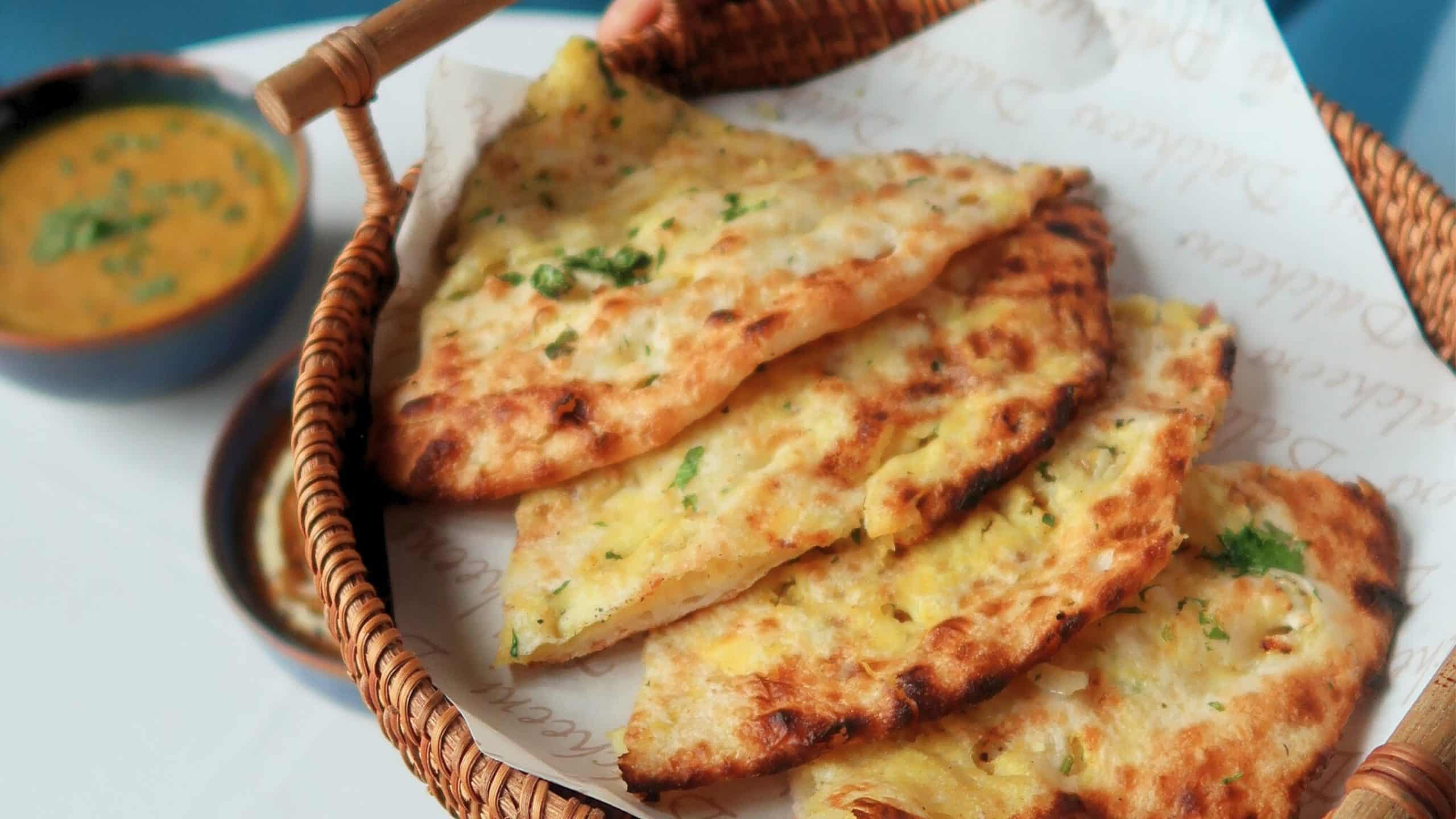 Dalcheeni Welcomes You with tandoor-baked Naan — golden, gooey, and deeply satisfying.