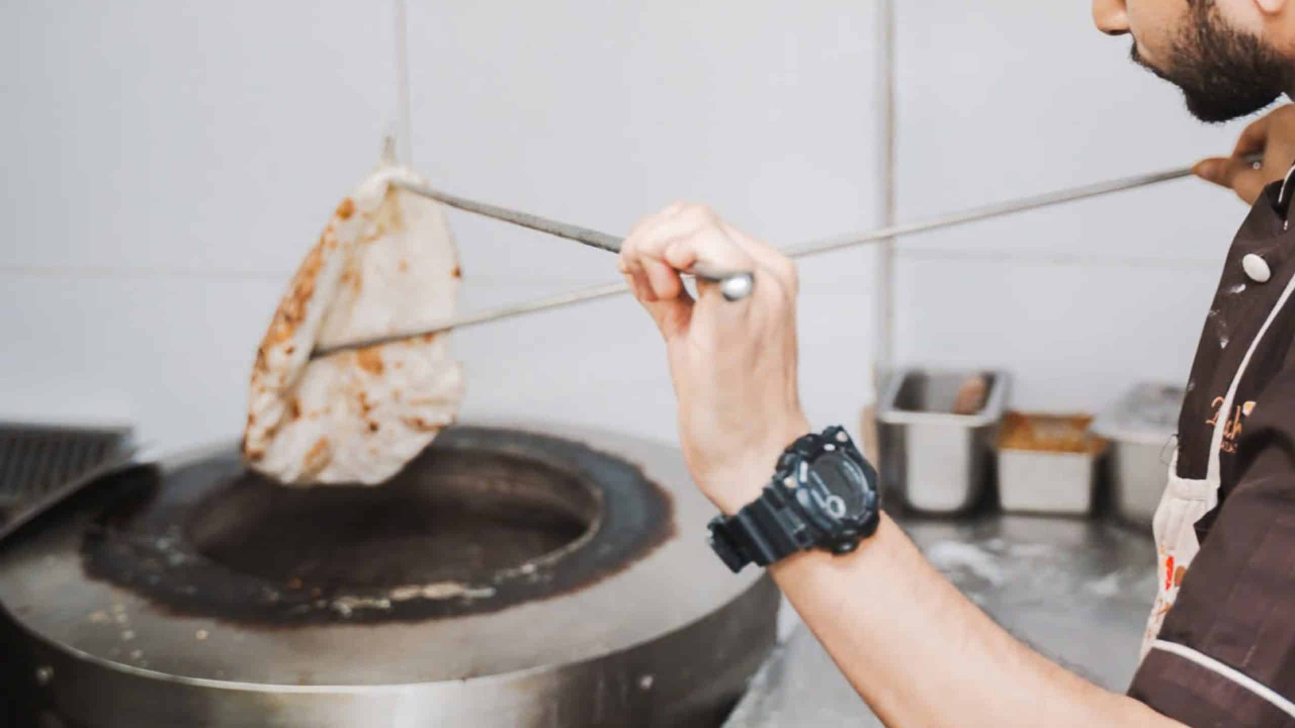 Baked in a blazing tandoor, naan is slapped onto the oven’s clay walls, where it cooks in seconds — puffing up with a soft center, crisp edges, and a signature smoky flavor you can’t replicate anywhere else.